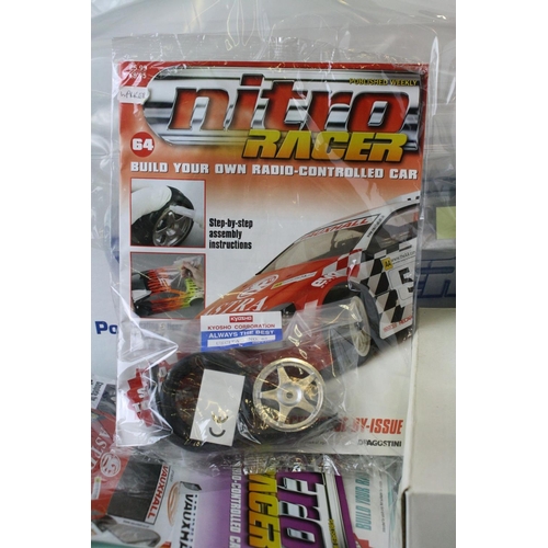 1179 - A large collection of DeAgostini Nitro Racer magazines together with associated car parts to include... 