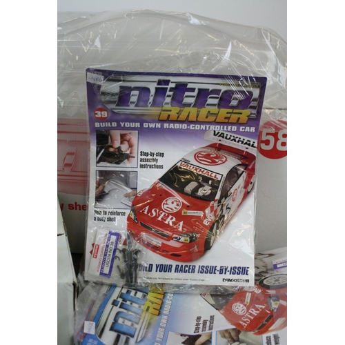 1179 - A large collection of DeAgostini Nitro Racer magazines together with associated car parts to include... 