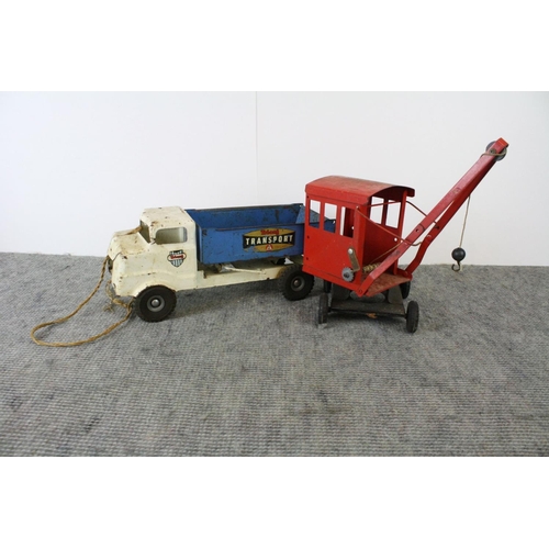 1181 - Two playworn Tri-ang tin plate toys, blue and white 'Transport' tipper truck & red crane