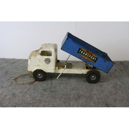 1181 - Two playworn Tri-ang tin plate toys, blue and white 'Transport' tipper truck & red crane