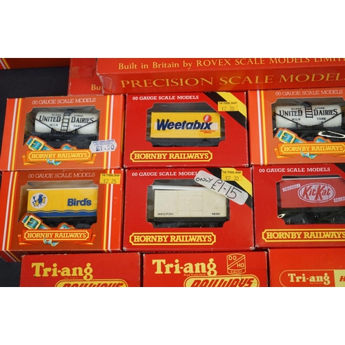 90 - 36 Boxed Hornby Triang OO gauge items of rolling stock to include coaches, vans and wagons featuring... 