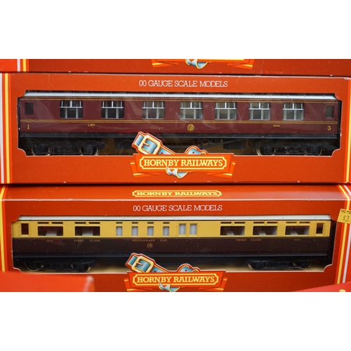 90 - 36 Boxed Hornby Triang OO gauge items of rolling stock to include coaches, vans and wagons featuring... 