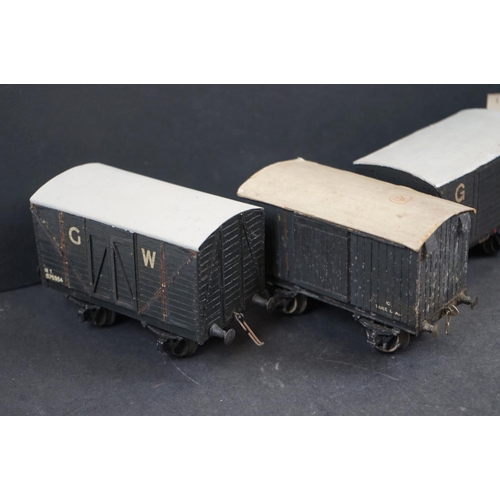 142 - Ten mid 20th C O gauge items of rolling stock featuring trucks and wagons, wooden compositions