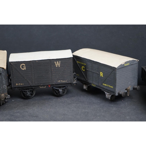 142 - Ten mid 20th C O gauge items of rolling stock featuring trucks and wagons, wooden compositions