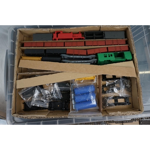 143 - Quantity of OO gauge model railway to include plastic trackside buildings, rolling stick spares and ... 