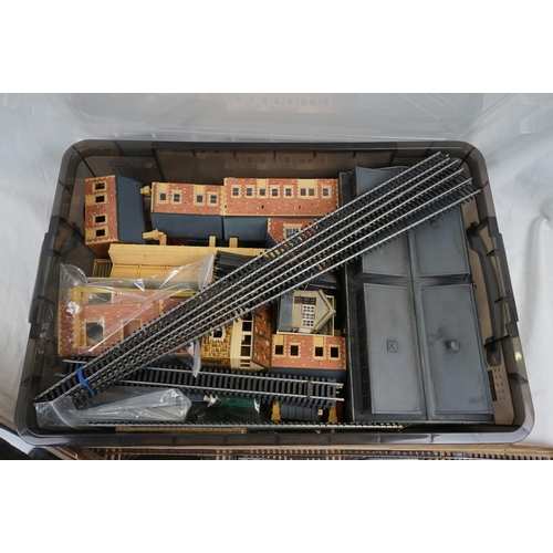 143 - Quantity of OO gauge model railway to include plastic trackside buildings, rolling stick spares and ... 