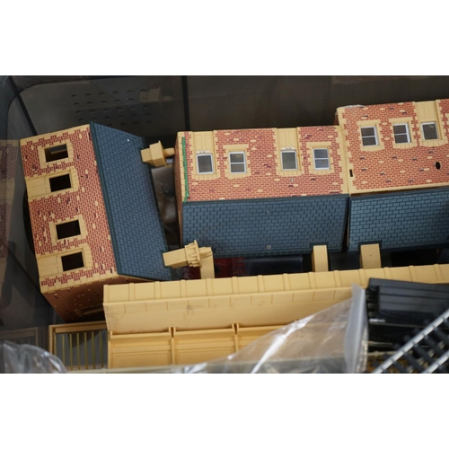 143 - Quantity of OO gauge model railway to include plastic trackside buildings, rolling stick spares and ... 