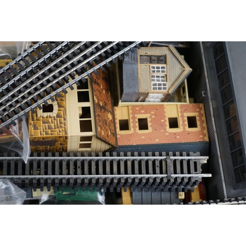 143 - Quantity of OO gauge model railway to include plastic trackside buildings, rolling stick spares and ... 