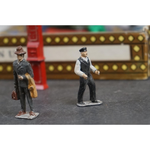 238 - A collection of mainly Britains lead Railway related figures and accessories to include benches, tic... 