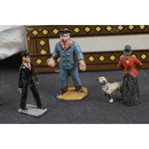 238 - A collection of mainly Britains lead Railway related figures and accessories to include benches, tic... 