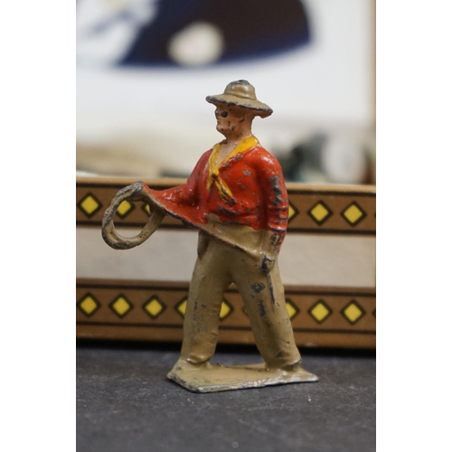 241 - A collection of approx 30 x Britains lead Cowboy and Indian figures.