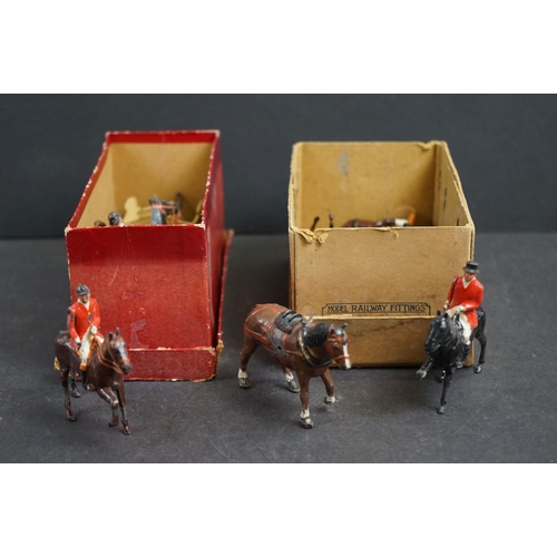 245 - A collection of mainly Britains lead figures to include Fox hunting and farm equipment and animals.