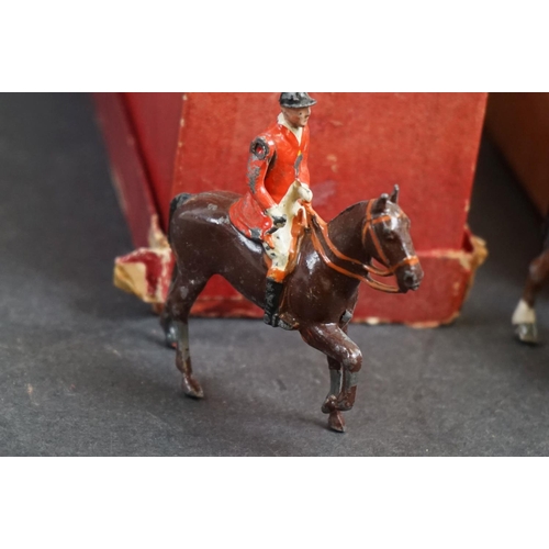 245 - A collection of mainly Britains lead figures to include Fox hunting and farm equipment and animals.