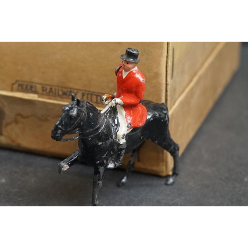 245 - A collection of mainly Britains lead figures to include Fox hunting and farm equipment and animals.