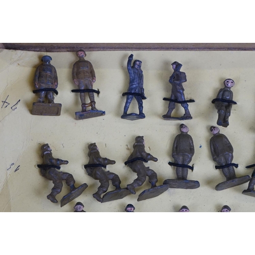 258 - Over 50 small scale mid 20th C painted metal  military figures to include Skybirds and Dinky plus un... 