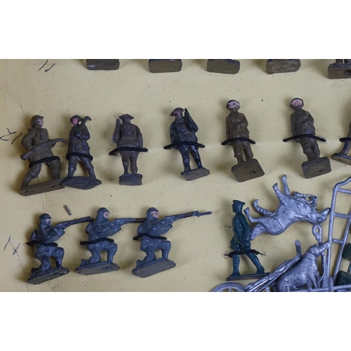 258 - Over 50 small scale mid 20th C painted metal  military figures to include Skybirds and Dinky plus un... 