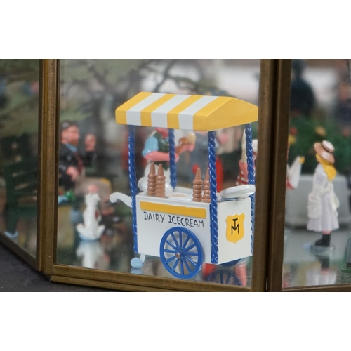 262 - A glass cased diorama titled 'Balloon Rides' with a display of painted metal figures and a suspended... 