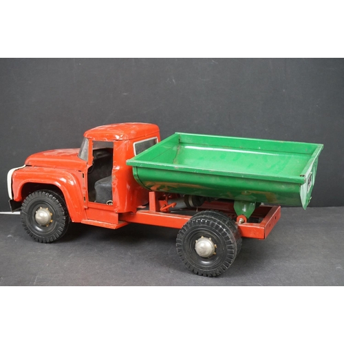 1087 - Circa 1970s metal Tipping Truck with red cab and chassis, green tipper, showing play wear, 21