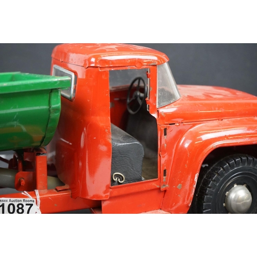 1087 - Circa 1970s metal Tipping Truck with red cab and chassis, green tipper, showing play wear, 21