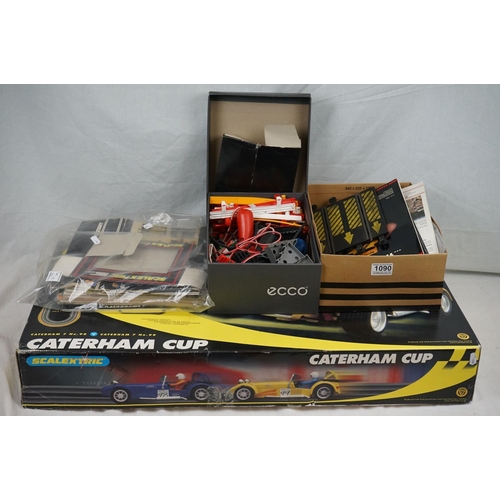 1090 - Boxed Scalextric Caterham Cup, appearing complete with two slot cars but unchecked (tatty box), plus... 