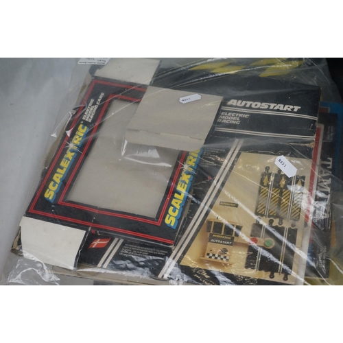 1090 - Boxed Scalextric Caterham Cup, appearing complete with two slot cars but unchecked (tatty box), plus... 