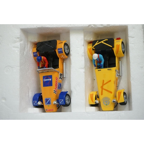 1090 - Boxed Scalextric Caterham Cup, appearing complete with two slot cars but unchecked (tatty box), plus... 