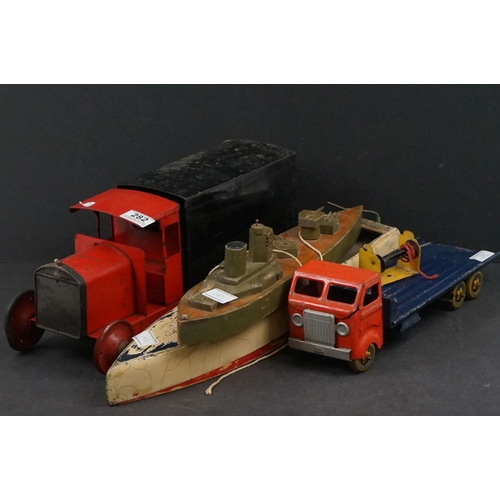 282 - Four early/mid 20th century tin plate and wooden models to include tin plate Lines Bros wagon in red... 