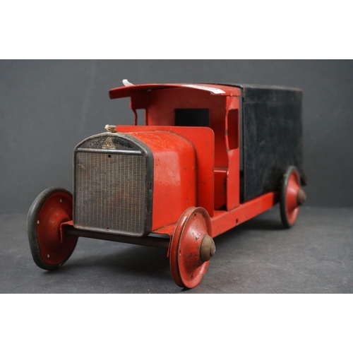 282 - Four early/mid 20th century tin plate and wooden models to include tin plate Lines Bros wagon in red... 