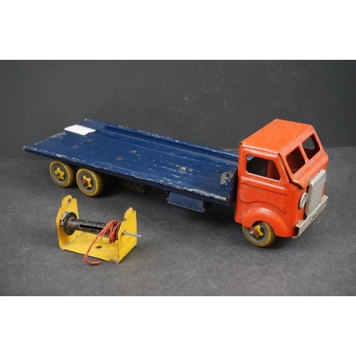 282 - Four early/mid 20th century tin plate and wooden models to include tin plate Lines Bros wagon in red... 