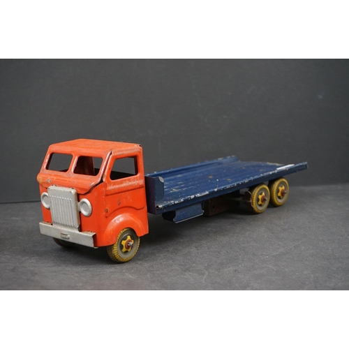 282 - Four early/mid 20th century tin plate and wooden models to include tin plate Lines Bros wagon in red... 