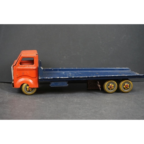 282 - Four early/mid 20th century tin plate and wooden models to include tin plate Lines Bros wagon in red... 