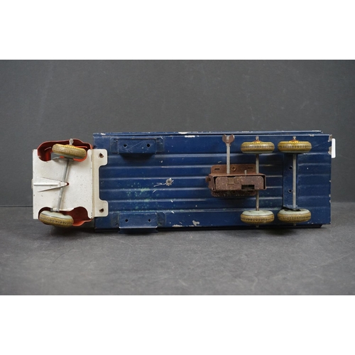 282 - Four early/mid 20th century tin plate and wooden models to include tin plate Lines Bros wagon in red... 