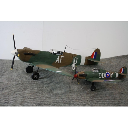 280 - Two kit built world war two model aircraft to include a spitfire and a hurricane, largest measures a... 