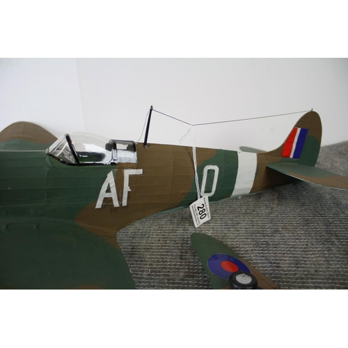 280 - Two kit built world war two model aircraft to include a spitfire and a hurricane, largest measures a... 