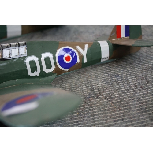 280 - Two kit built world war two model aircraft to include a spitfire and a hurricane, largest measures a... 