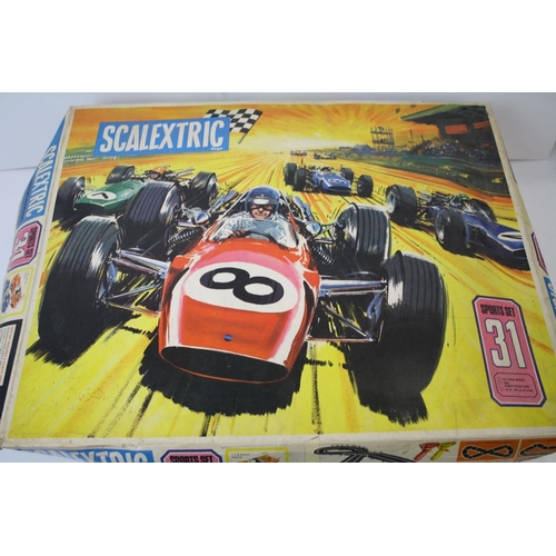 1090 - Boxed Scalextric Caterham Cup, appearing complete with two slot cars but unchecked (tatty box), plus... 