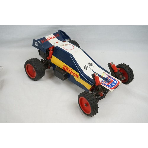 1093 - Two assembled radio control vehicles to include HB Monster Truck, appearing complete with foam wheel... 