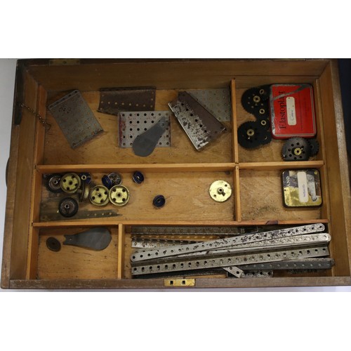 187 - Mid 20th century Meccano wooden box (with key), containing a number of parts, together with a furthe... 