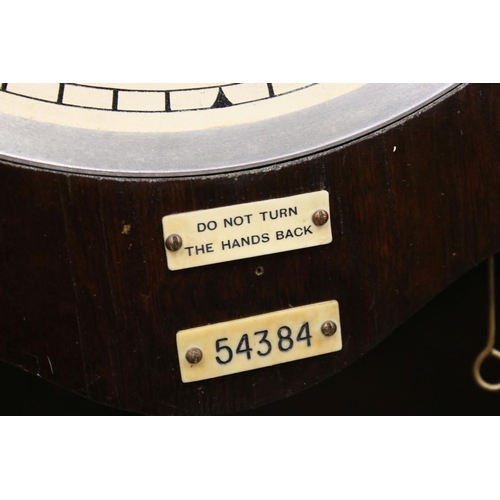38 - An early 20th century oak cased Gledhill Brook Time Recorder clocking in clock together with a wall ... 