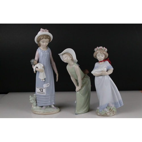 12 - Three Lladro figures to include Girl holding chicken, Girl looking coy and Girl holding doll.