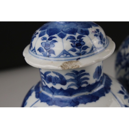 17 - Two Chinese blue and white lidded vases with floral decoration, both signed with six Character marks... 