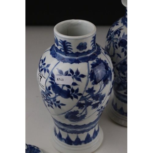 17 - Two Chinese blue and white lidded vases with floral decoration, both signed with six Character marks... 