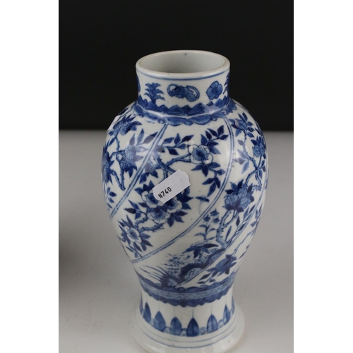 17 - Two Chinese blue and white lidded vases with floral decoration, both signed with six Character marks... 