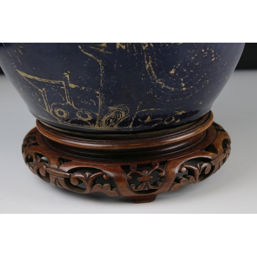 21 - Chinese Blue ground ovoid lidded Vase with rubbed gilt decoration, 22 cm tall together with a carved... 