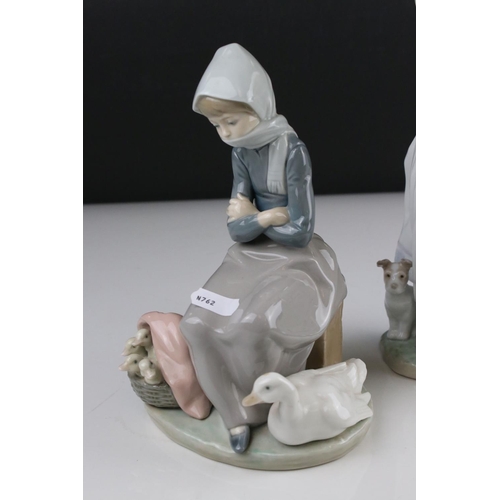 3 - Two Lladro figures in the form of girl with duck and ducklings and a girl with dog by post box.