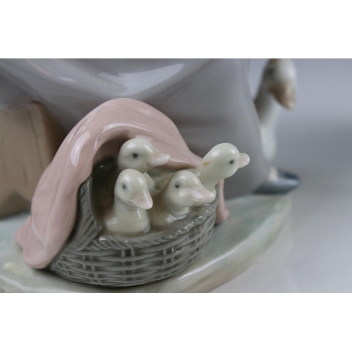 3 - Two Lladro figures in the form of girl with duck and ducklings and a girl with dog by post box.