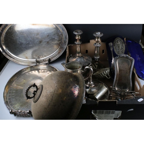 61 - A quantity of Silver plate and metal ware to include trays candle sticks tankards, toast racks, pepp... 