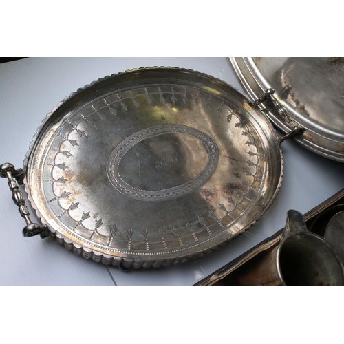 61 - A quantity of Silver plate and metal ware to include trays candle sticks tankards, toast racks, pepp... 