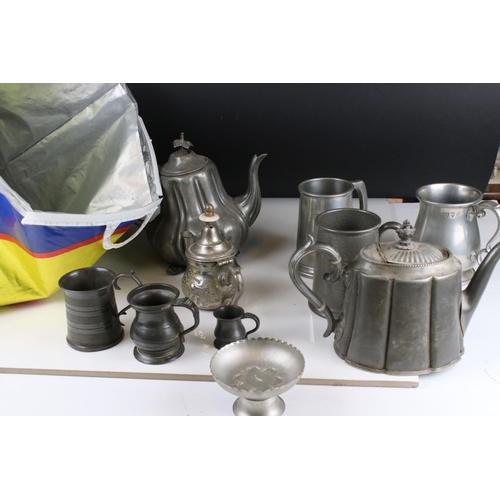 61 - A quantity of Silver plate and metal ware to include trays candle sticks tankards, toast racks, pepp... 