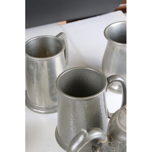 61 - A quantity of Silver plate and metal ware to include trays candle sticks tankards, toast racks, pepp... 